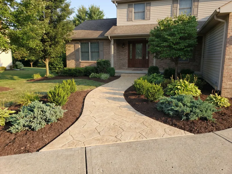 Slip-resistant coated walkway leading to a residential entry
